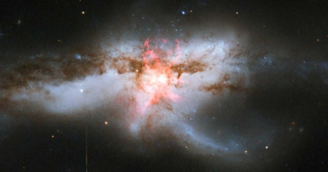 astronomers galaxy three supermassive black holes